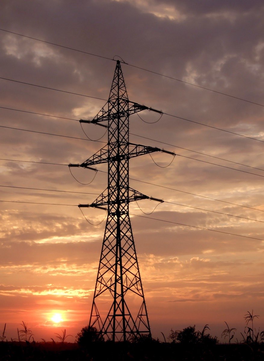 Power Generation — transmission tower at sunset